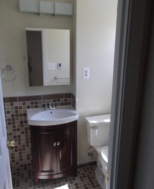 bathroom remodeling complete vanity and tile work floor and wall